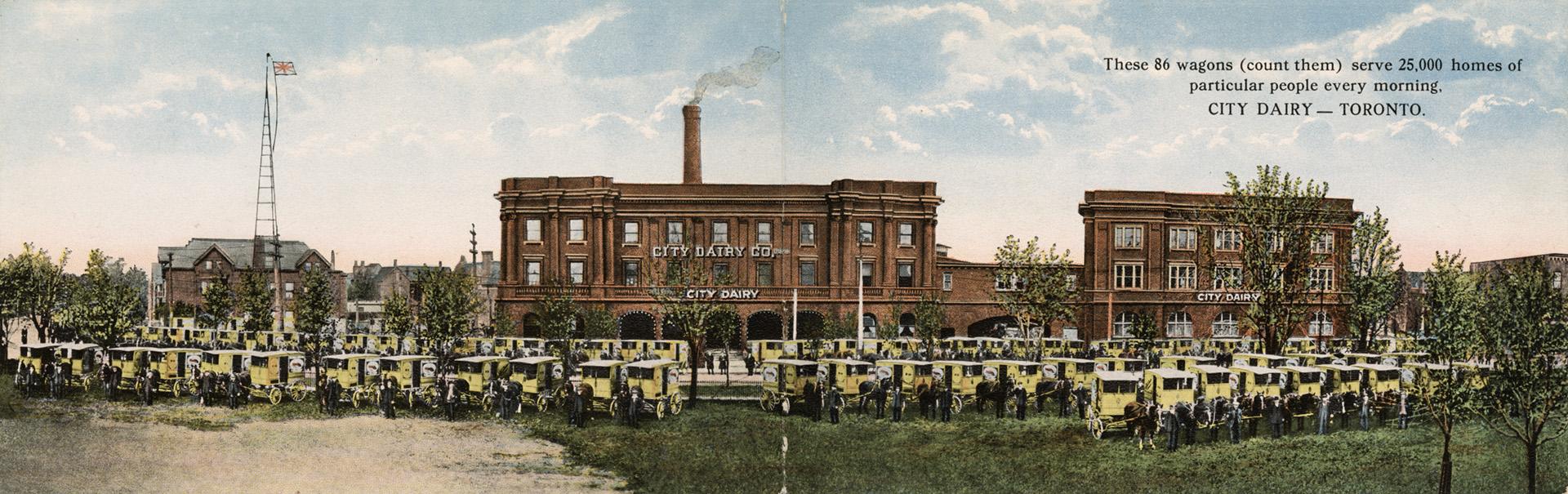 Colour folded postcard that opens up to depict a panoramic photo of three brown buildings and 8 ...