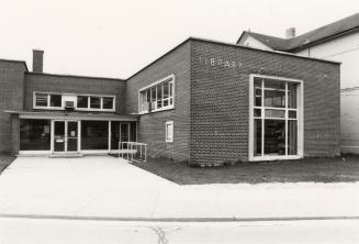 Picture of one storey library building entrance. 