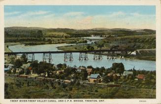 Colorized of long bridge spanning a river.