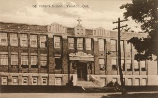 Black and white photograph of two story collegiate building.