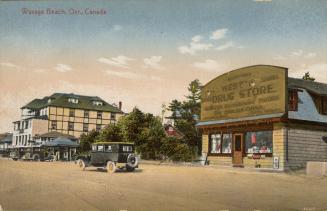 Colorized photograph of an automobile driving on a road in front of a drug store building.