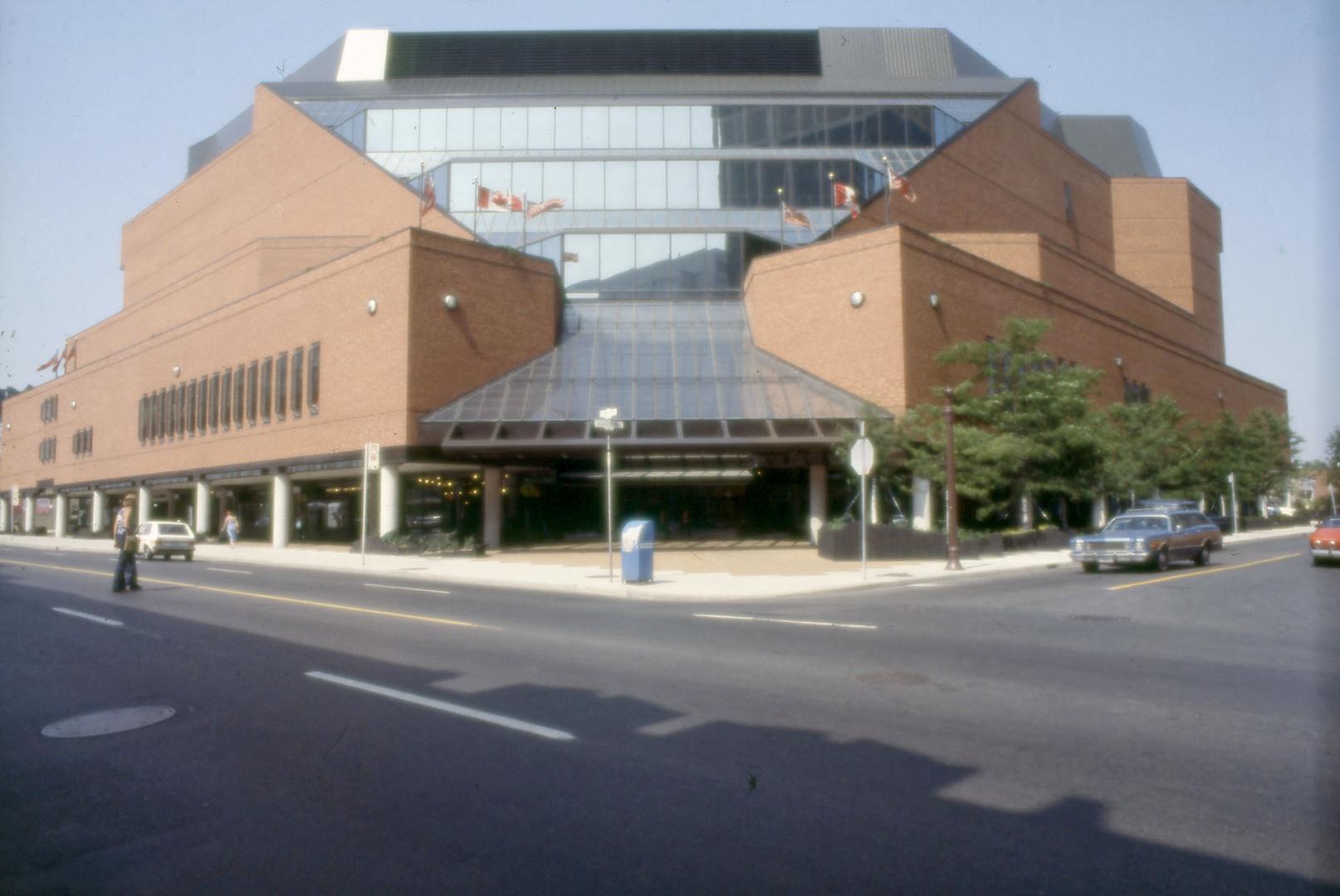 Exterior corner view of large multi-storey red brick library. 