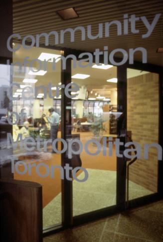 Picture of large glass display cases with exhibits in a library. 