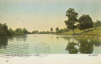 Colorized photograph of a narrow body of water surrounded by trees.
