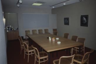 Picture of a meeting room with large table and several chairs
