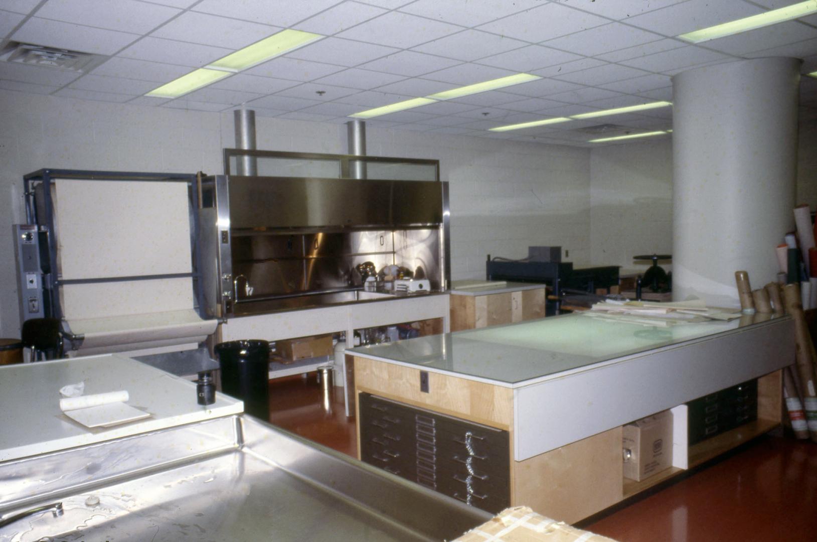 Picture of library work room with large table and special restoration equipment. 
