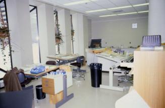 Picture of library work room with large table and special restoration equipment. 