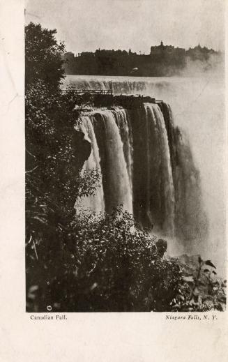 Black and white photograph of water cascading over cliffs.