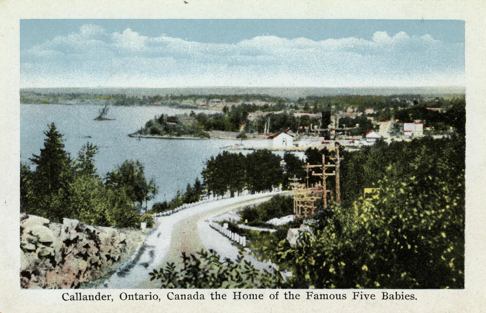 Colorized photograph of a road running into a small settlement in the bush.