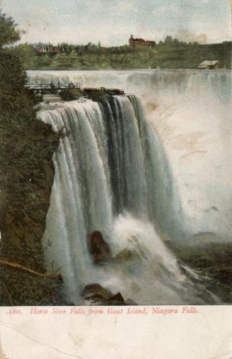 Colorized photograph of water cascading over rocks, with a lookout built over the top of them.
