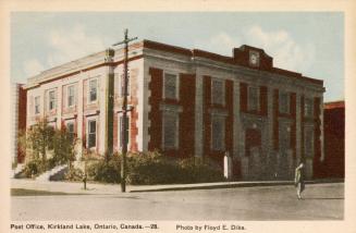 Colorized photograph of a large, two story commercial building.