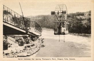 Photograph of a cable car crossing over a river with rapids.