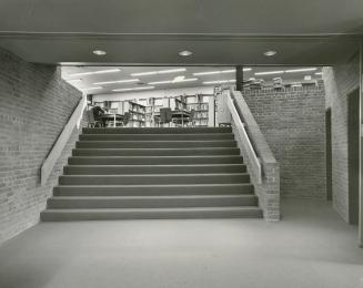 Picture of a library interior showing shelves of books. 