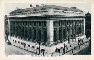 Black and white photograph of a large, neoclassical building.