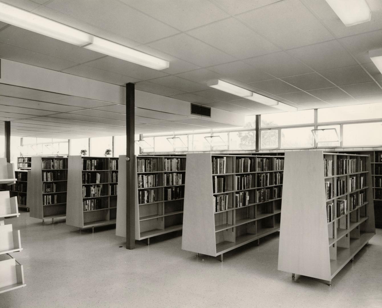 Picture of a 1950's library interior showing shelving. 