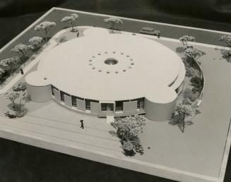 Picture of architectural model of round library building. 