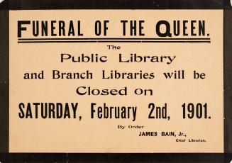 Sign with black lettering on beige background with black trim. 