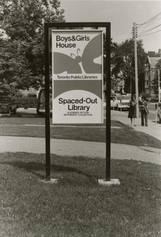Picture of a sign on a lawn for Boys & Girls House and Spaced-Out Library