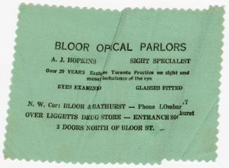 A green eyeglass cloth with zigzag edges, printed with an advertisement stating "Bloor Optical …