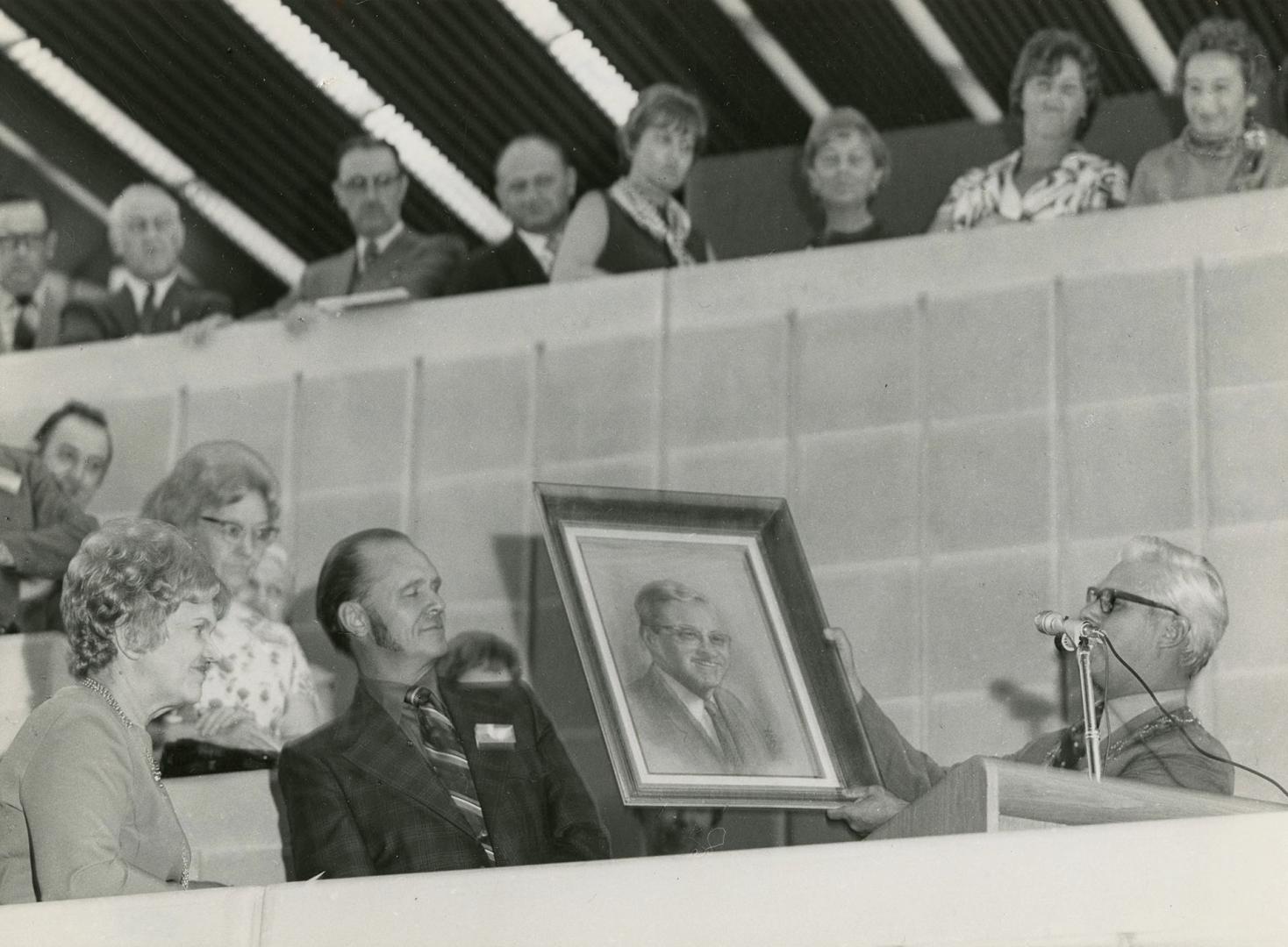 Mayor W. White presenting painting of Albert Campbell to the new library to Dr. T.H. Leith, former Chairman of the Library Board, and Mrs. Helen Peterson, Director of Scarborough Public Library 