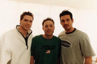 3 Clean cut young men in t-shirts against a white background. 