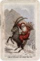 The card pictures a man riding a goat in the snow. The man is dressed in red with a white beard…