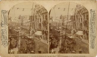 Picture looking down the middle of a wide street with buildings on both sides and buildings wit…