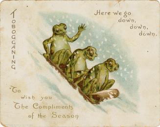 The card pictures three frogs tobogganing down a snowy hill.
