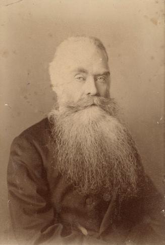 portrait photograph of elderly man with a long beard