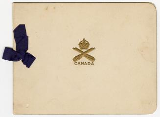The front of the card contains a gold, embossed emblem of a crown above two rifles and the word…