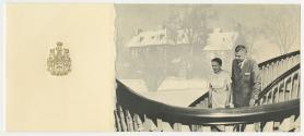 Photograph of John and Olive Diefenbaker descending a staircase; a faint photo of the exterior …