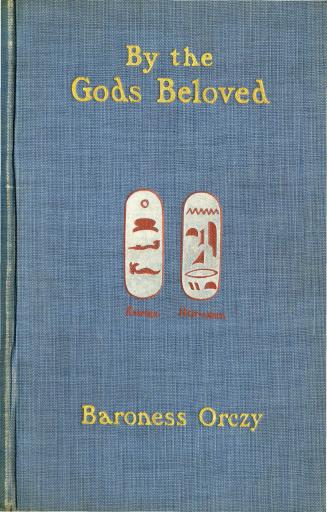 Blue cloth cover with title and author in gold. In the middle are two ovals containing red hier ...