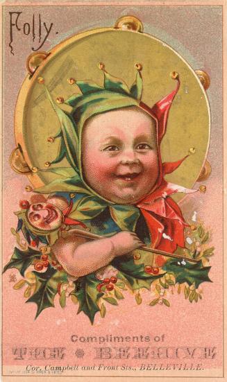 Folly --A smiling baby in a red & green fairy hat --Compliments of THE BEEHIVE