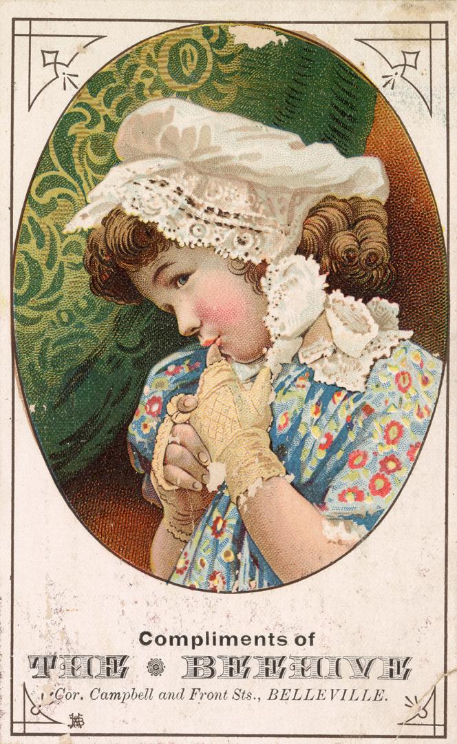 Girl wearing a bonnet --Compliments of  THE BEEHIVE
