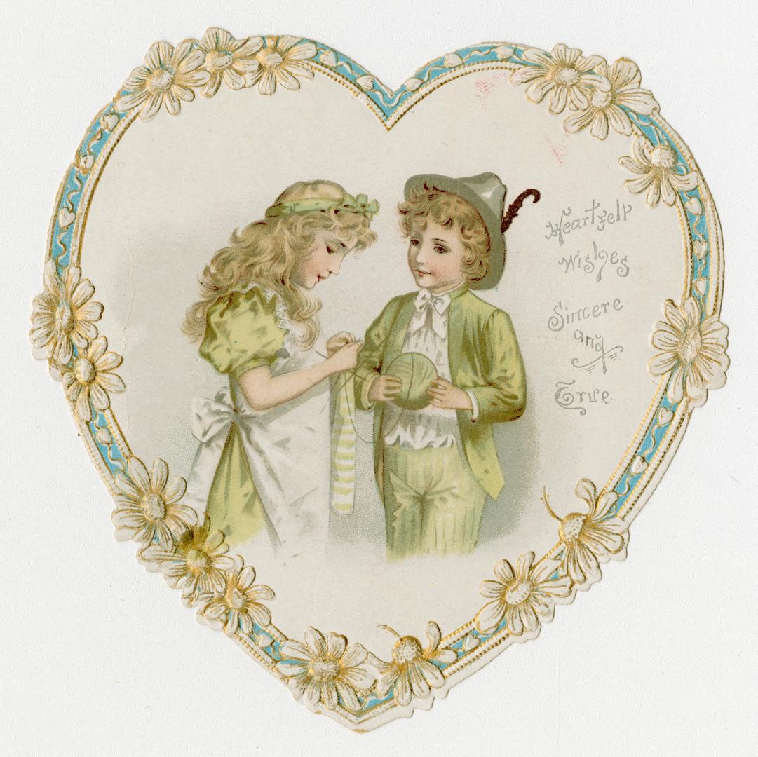 A flat, heart-shaped card. The image at the centre shows a girl knitting a sock while a boy hol ...