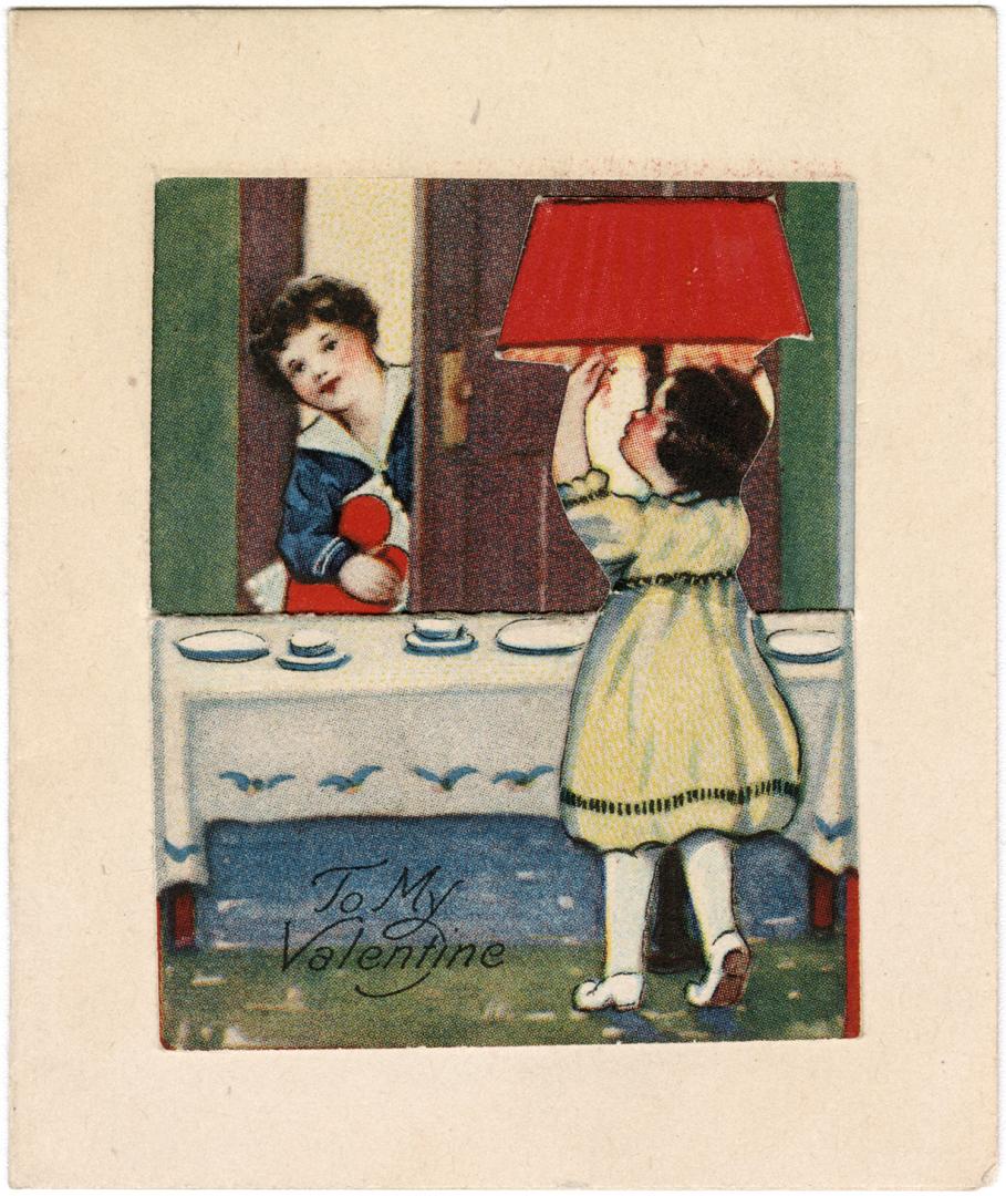 A girl turns on a lamp as a boy looks through the door while holding a heart. Made in the U.S.A ...