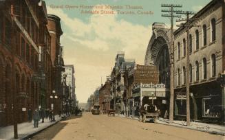 Colorized photograph of a city street with tall building on either side.