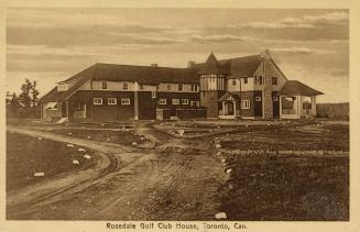 Sepia-toned postcard depicting a golf club house house with its unpaved front driveway. The cap ...