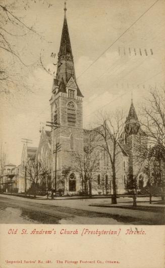 Black and white photograph of a large, gothic church with a spire.