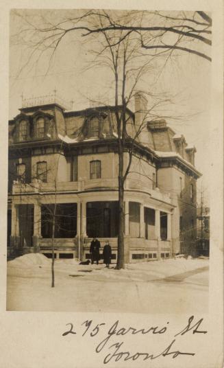 Black and white photograph of Victorian house in the Second Empire style.