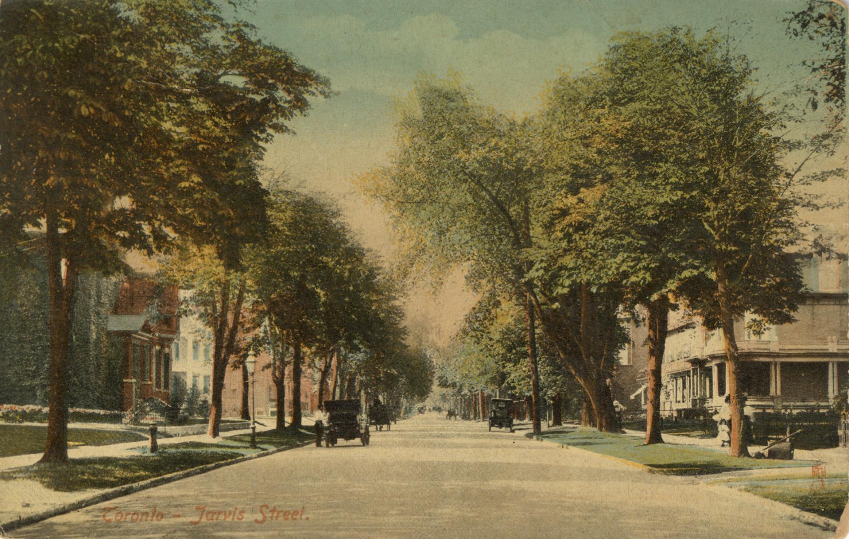 Colorized photograph of a city street bordered by large trees and houses. People and carriages  ...