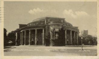 Black and white photograph of a large Beaux-Arts building with a domed roof.