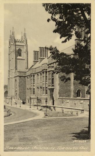 Black and white photograph of a large, gothic style collegiate building with a central tower.