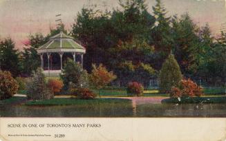 Colorized photograph of a band shelter in a park beside a body of water.