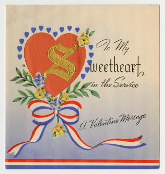 A heart decorated with blue and yellow flowers and red, white and blue ribbon is pictured on th ...