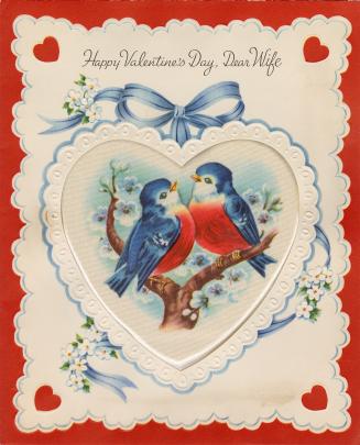 At the centre of the card is a heart-shaped silk insert. It pictures two blue birds with red br ...