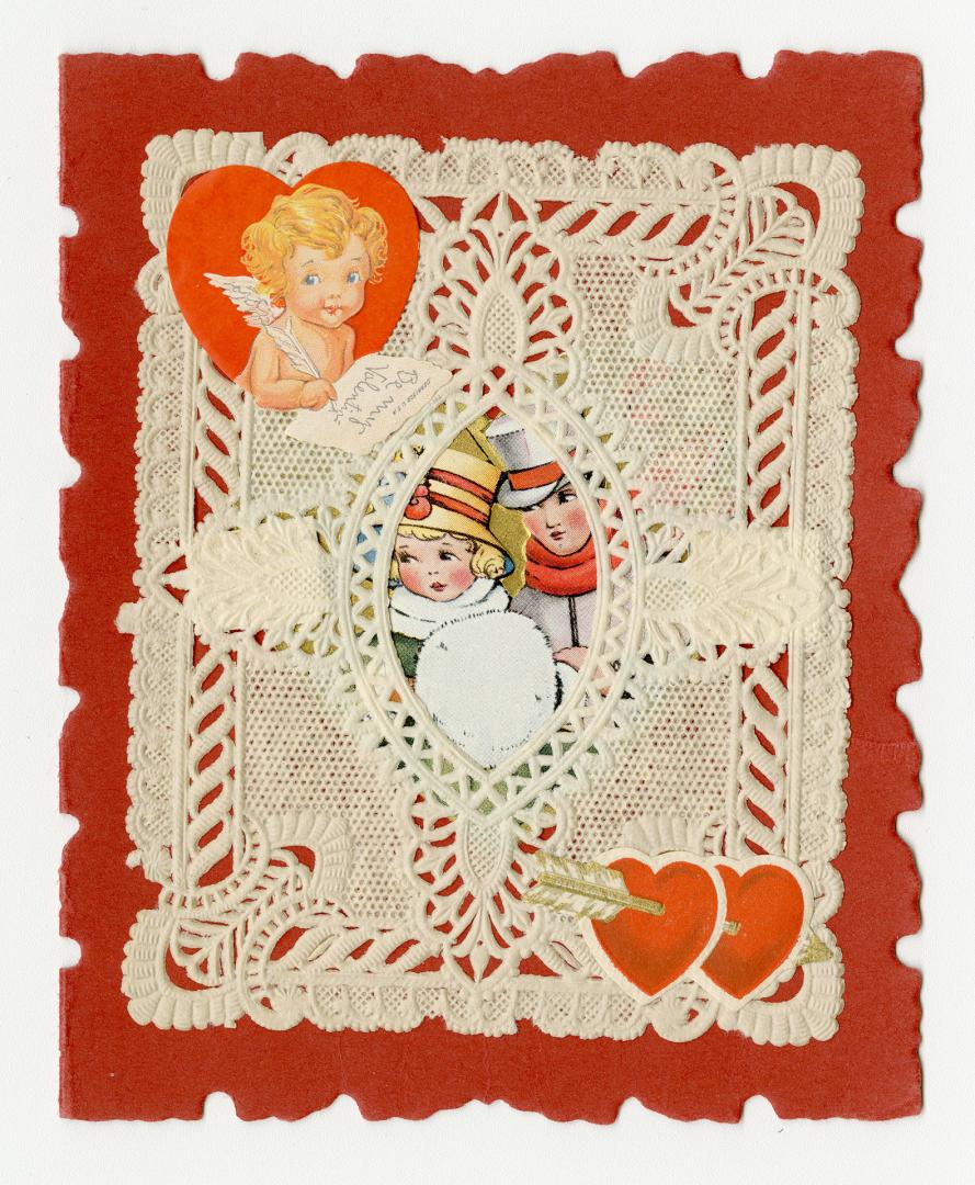 Features a doily with a central oval window showing two people in winter clothing. A cherub is  ...